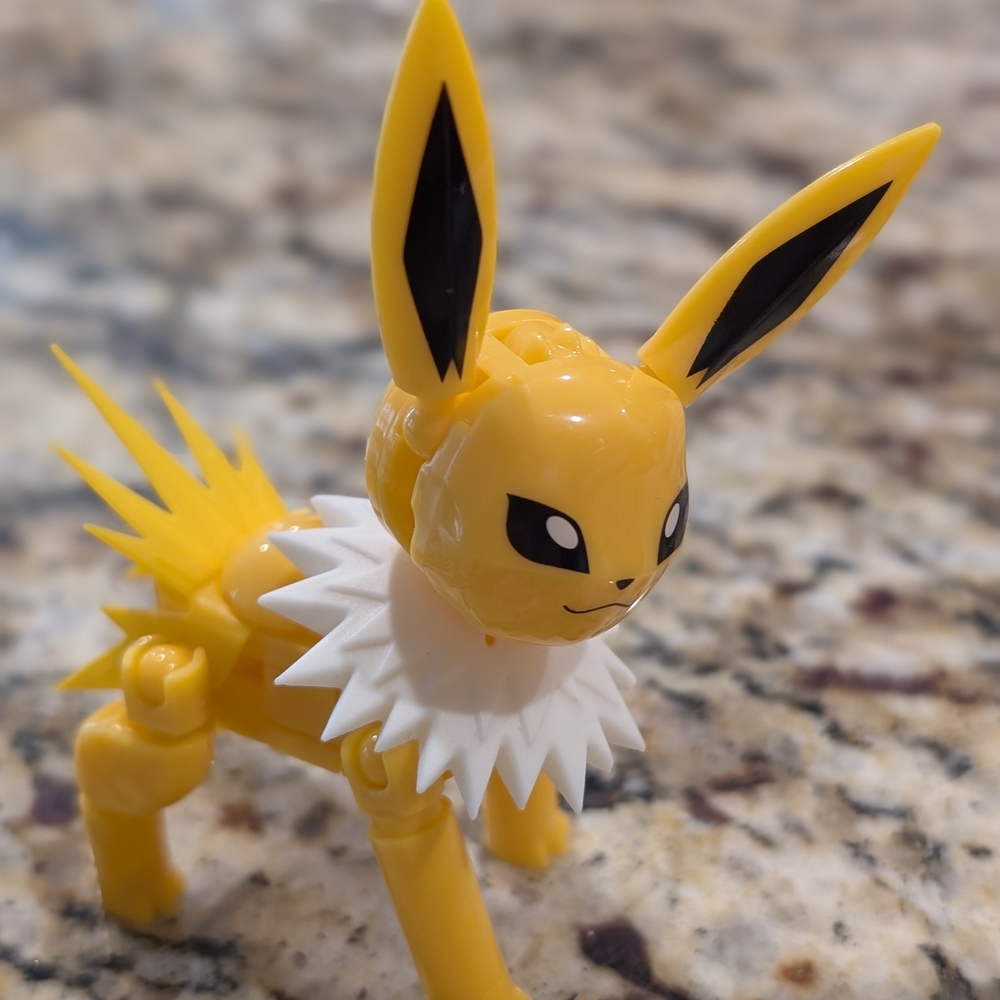 Yellow and White Toy Figure